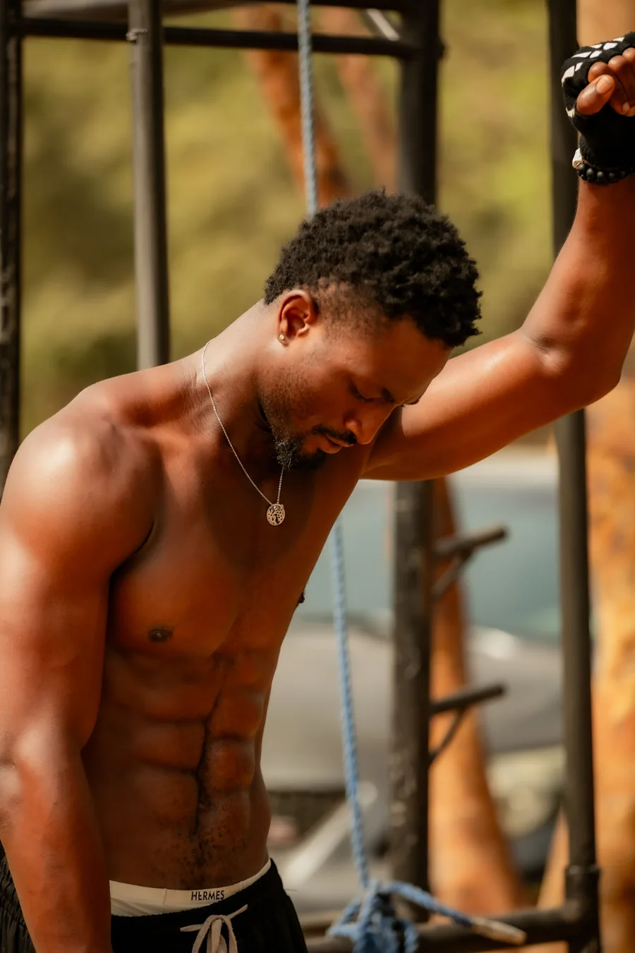 Man resting between sets in an outdoor gym